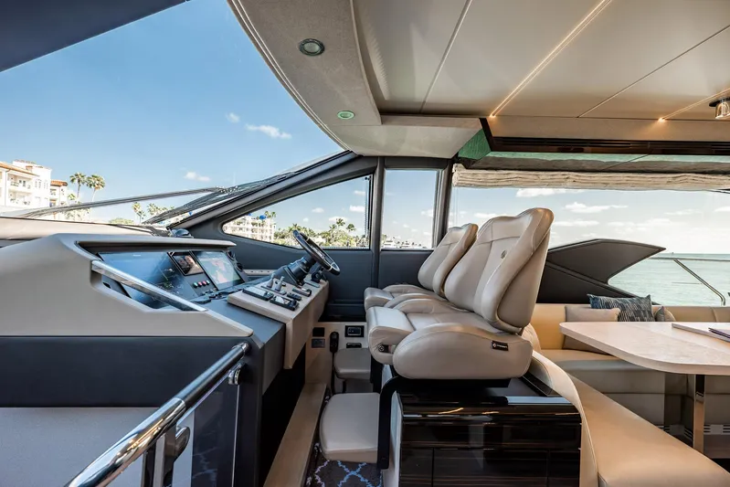 Amici Yacht Photos Pics Luxurious interior of 2017 Azimut 66 yacht with modern helm and seating.