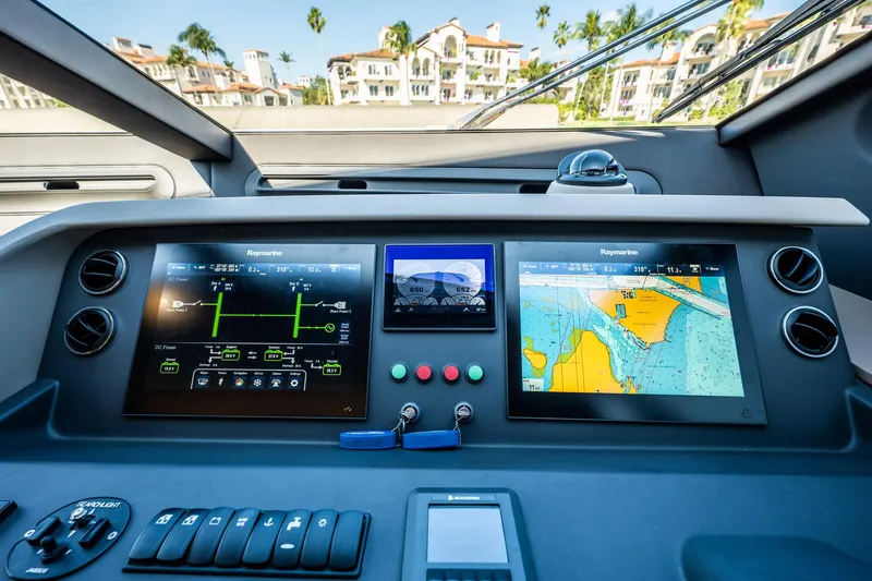 Amici Yacht Photos Pics Control panel of a 2017 Azimut 66 yacht with navigation screens and controls.
