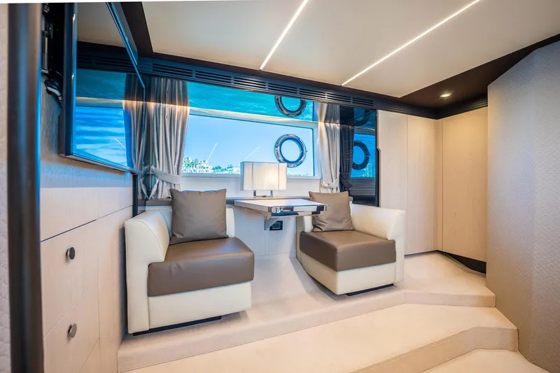 Amici Yacht Photos Pics Luxurious interior of 2017 Azimut 66 yacht with modern seating and large windows.