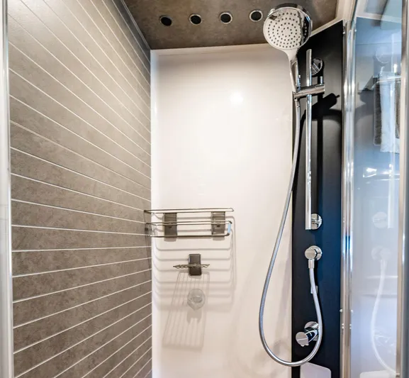 Amici Yacht Photos Pics Modern shower in 2017 Azimut 66 yacht with sleek fixtures and tiled walls.