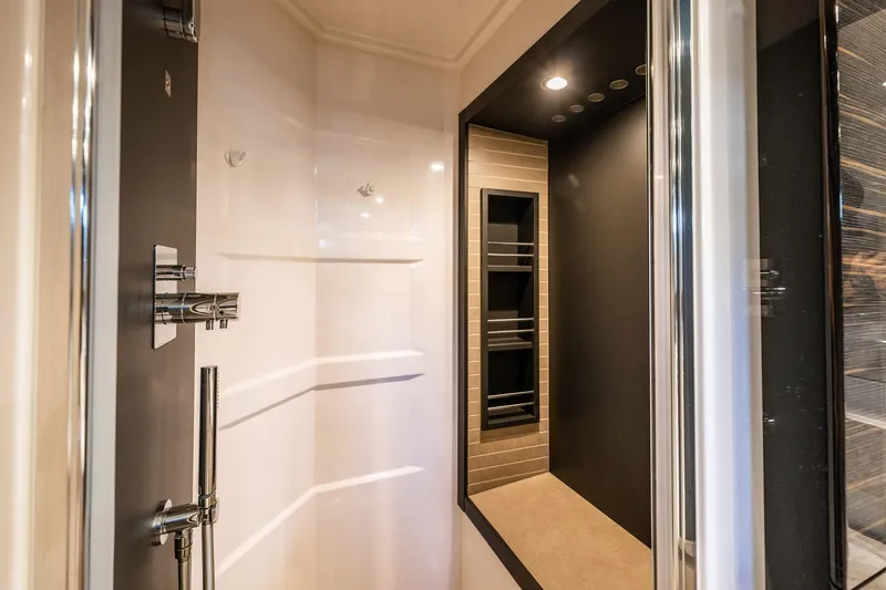 Amici Yacht Photos Pics Luxurious shower area in a 2017 Azimut 66 yacht, featuring modern fixtures and elegant design.