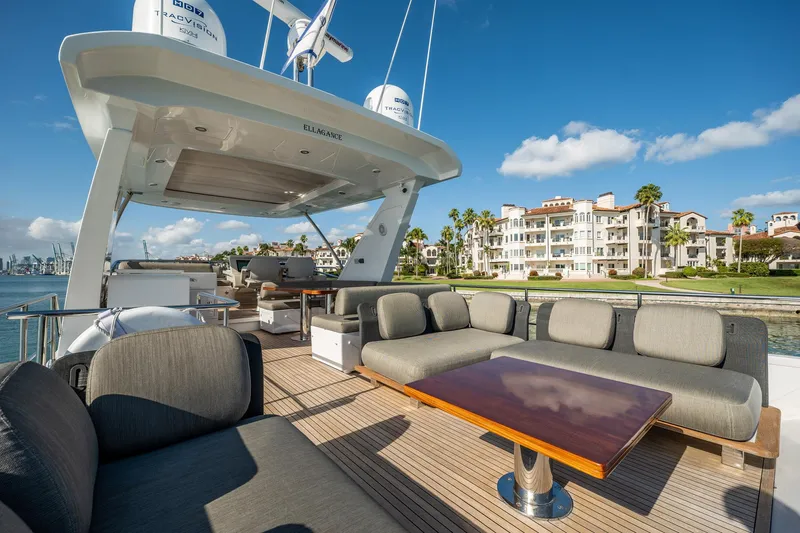 Amici Yacht Photos Pics Luxurious 2017 Azimut 66 yacht deck with elegant seating and scenic waterfront view.
