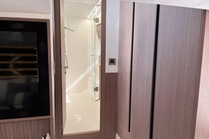  Yacht Photos Pics Interior of 2024 Galeon 425 HTS yacht, featuring modern wood paneling and sleek bathroom design.