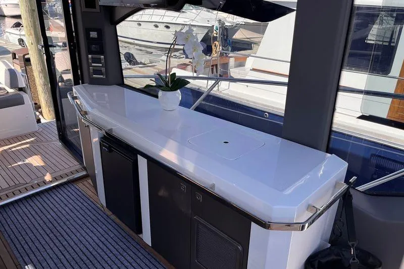  Yacht Photos Pics 2024 Galeon 425 HTS yacht interior with sleek countertop and potted orchid.