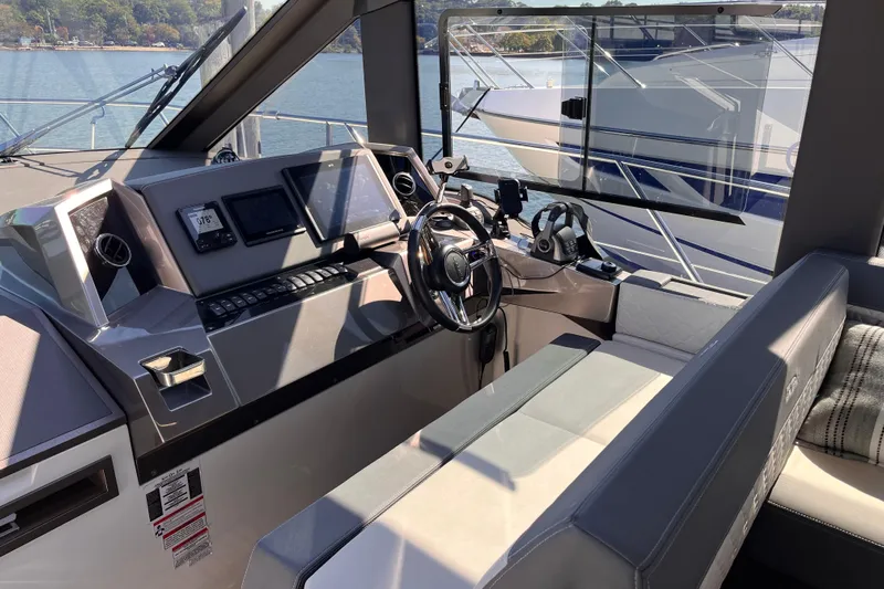  Yacht Photos Pics 2024 Galeon 425 HTS helm with modern controls and panoramic water view.