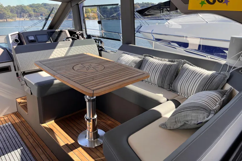  Yacht Photos Pics Luxurious interior of 2024 Galeon 425 HTS yacht with elegant seating and wooden table.