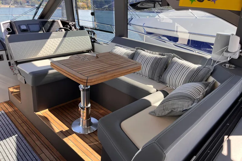  Yacht Photos Pics Luxurious interior of 2024 Galeon 425 HTS yacht with elegant seating and wooden table.