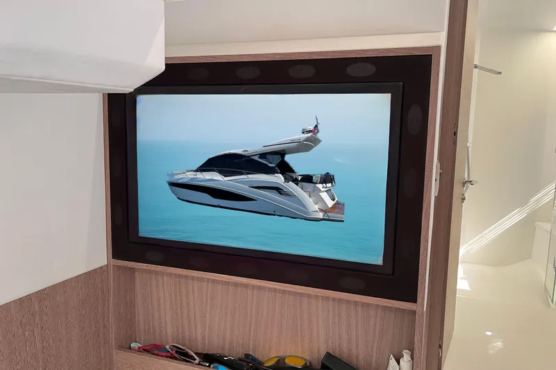  Yacht Photos Pics 2024 Galeon 425 HTS yacht displayed on a wall-mounted screen in a modern interior.