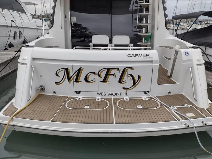 Trades Welcome Yacht Photos Pics 1999 Carver 530 Voyager Pilothouse yacht named McFly docked at marina.