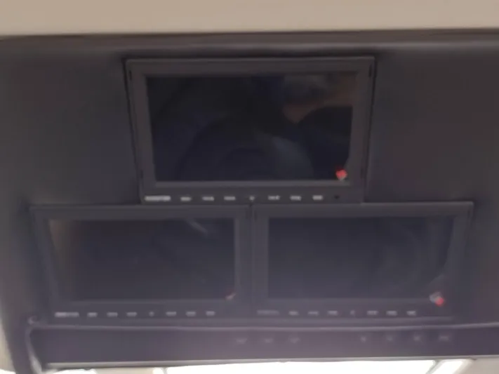 Trades Welcome Yacht Photos Pics Three black screens on the dashboard of a 1999 Carver 530 Voyager Pilothouse.