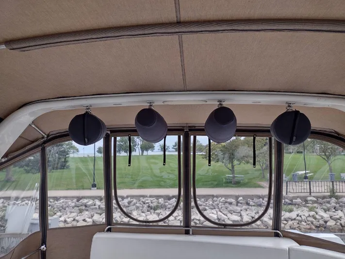 Trades Welcome Yacht Photos Pics Interior view of 1999 Carver 530 Voyager Pilothouse with hanging speakers.