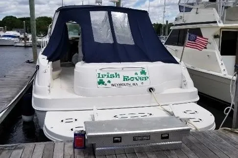Irish Rover Yacht Photos Pics 2000 Sea Ray 460 Sundancer docked, featuring "Irish Rover" signage and American flag.