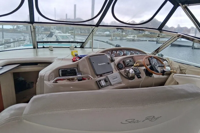 Irish Rover Yacht Photos Pics Interior view of 2000 Sea Ray 460 Sundancer yacht cockpit with navigation equipment.