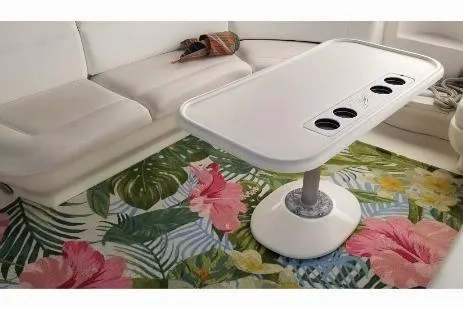 Irish Rover Yacht Photos Pics Interior of 2000 Sea Ray 460 Sundancer with floral rug and white seating.