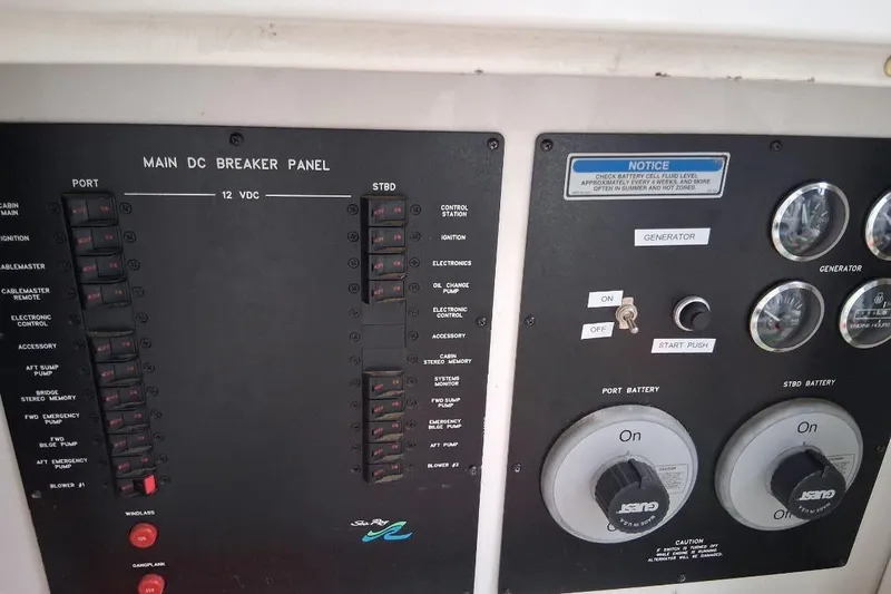 Irish Rover Yacht Photos Pics Main DC breaker panel on 2000 Sea Ray 460 Sundancer boat, featuring battery controls and gauges.