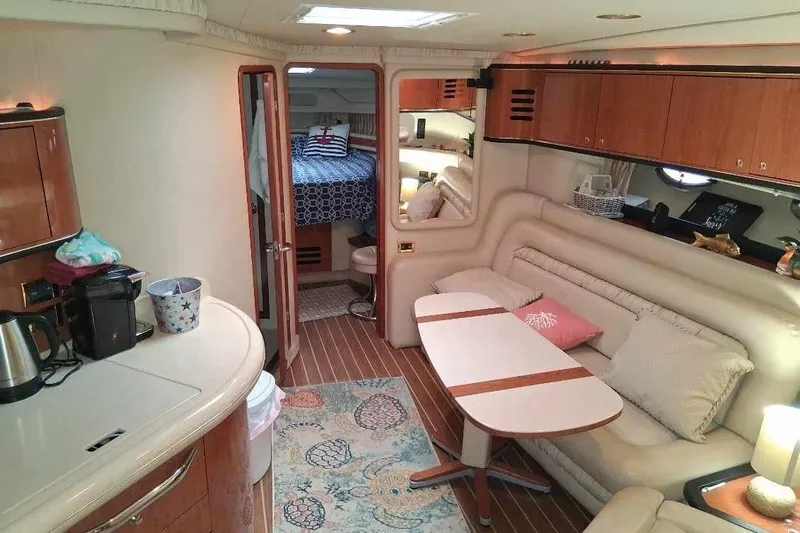 Irish Rover Yacht Photos Pics Luxurious interior of 2000 Sea Ray 460 Sundancer yacht with cozy seating and modern amenities.