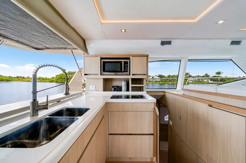 Altair Yacht Photos Pics Modern kitchen interior of 2019 Aquila 44 Yacht with sleek design and scenic water view.