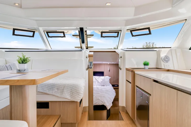 Altair Yacht Photos Pics Luxurious interior of 2019 Aquila 44 Yacht with modern furnishings and natural light.