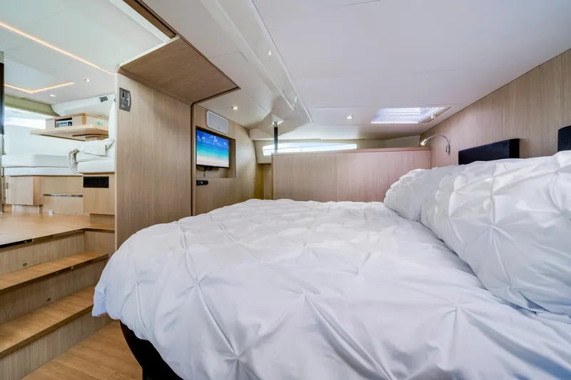 Altair Yacht Photos Pics Luxurious interior of 2019 Aquila 44 Yacht with cozy bed and modern decor.