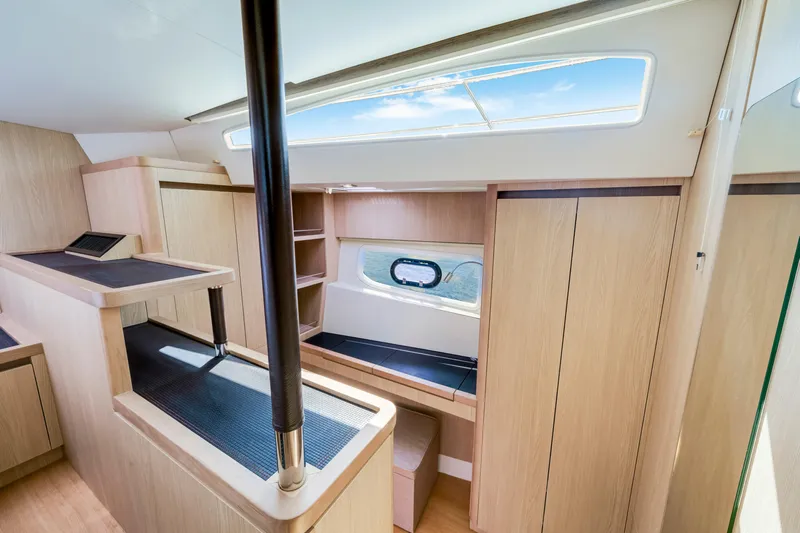 Altair Yacht Photos Pics Luxurious interior of 2019 Aquila 44 Yacht with modern wood finish and ample natural light.