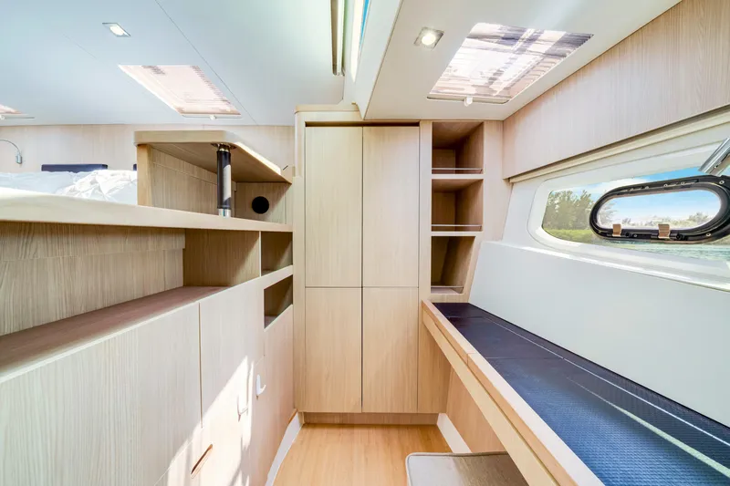 Altair Yacht Photos Pics Luxurious interior of 2019 Aquila 44 Yacht with modern wood finish and ample natural light.