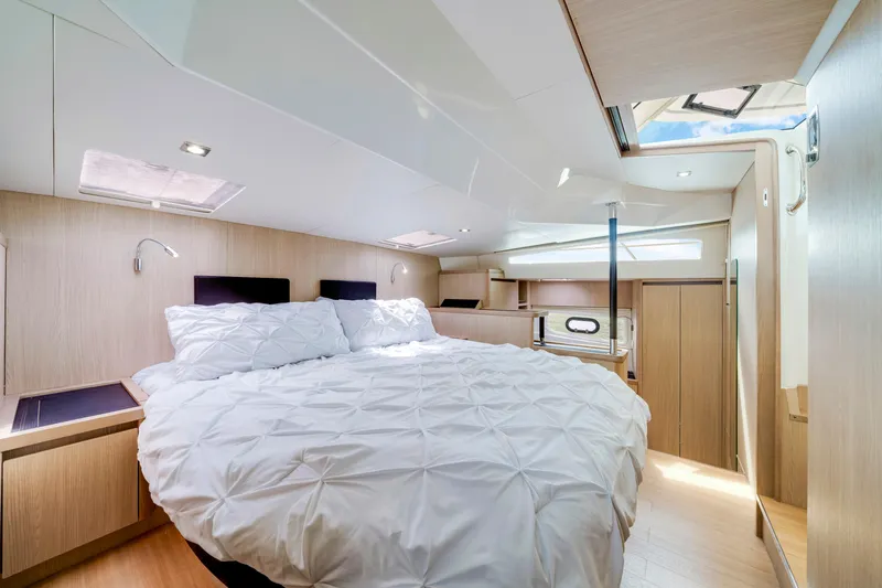 Altair Yacht Photos Pics Luxurious bedroom interior of 2019 Aquila 44 Yacht with modern design and skylight.