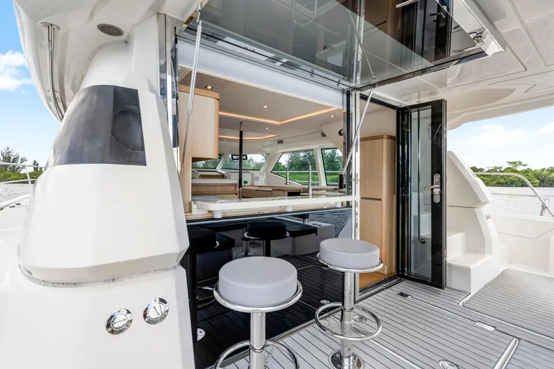 Altair Yacht Photos Pics 2019 Aquila 44 Yacht interior with modern seating and open deck view.