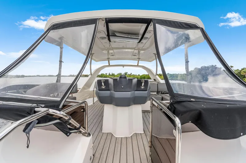 Altair Yacht Photos Pics Aquila 44 Yacht 2019 cockpit with clear canopy, sleek design, and scenic water view.