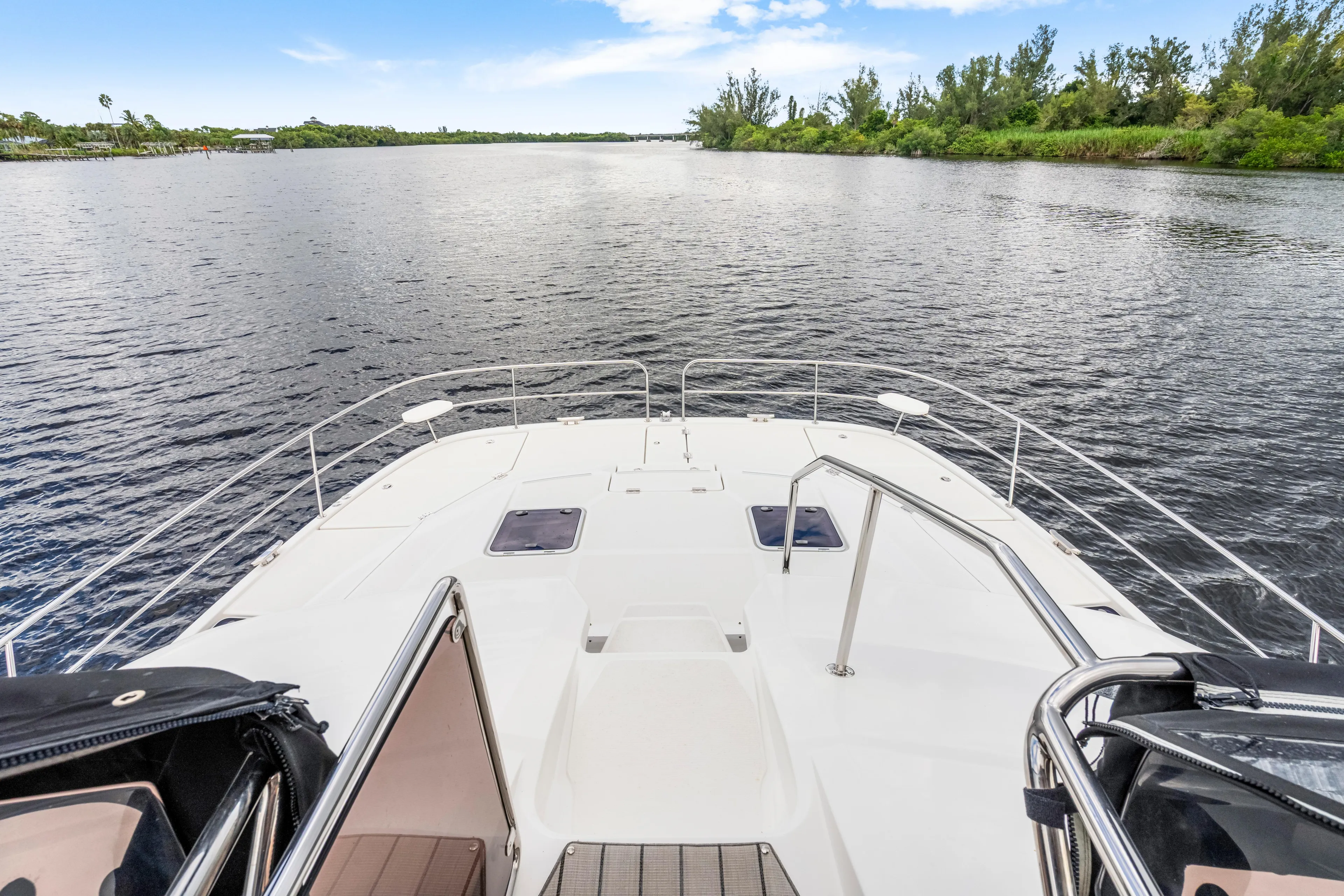 Altair Yacht Photos Pics Aquila 44 Yacht 2019 cruising on a serene river with lush green banks.