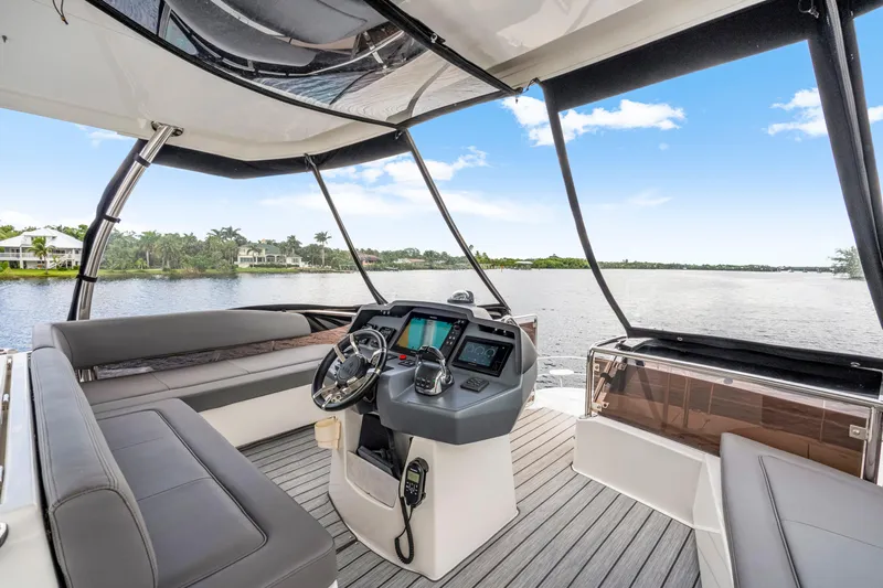 Altair Yacht Photos Pics Luxurious 2019 Aquila 44 Yacht interior with modern helm and scenic water view.