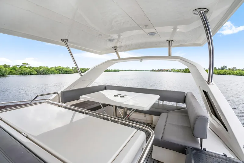 Altair Yacht Photos Pics Luxurious 2019 Aquila 44 Yacht with spacious outdoor seating and scenic water view.