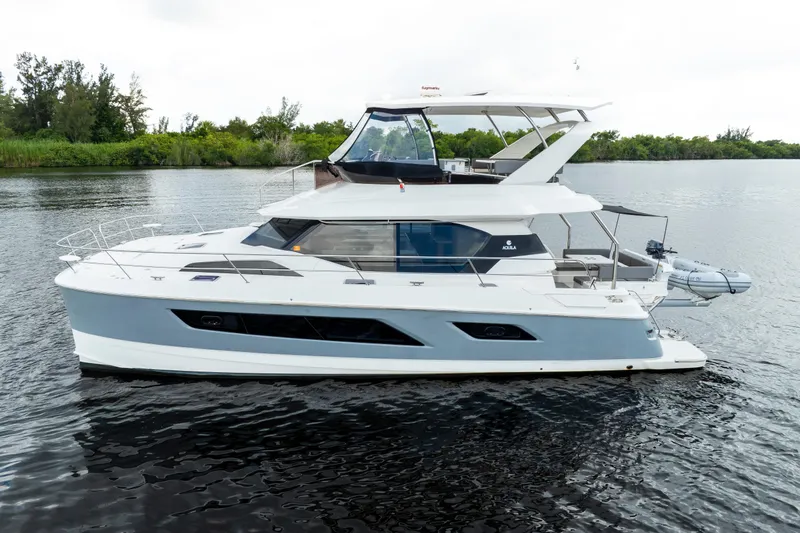 Altair Yacht Photos Pics 2019 Aquila 44 Yacht on calm water, showcasing sleek design and modern features.