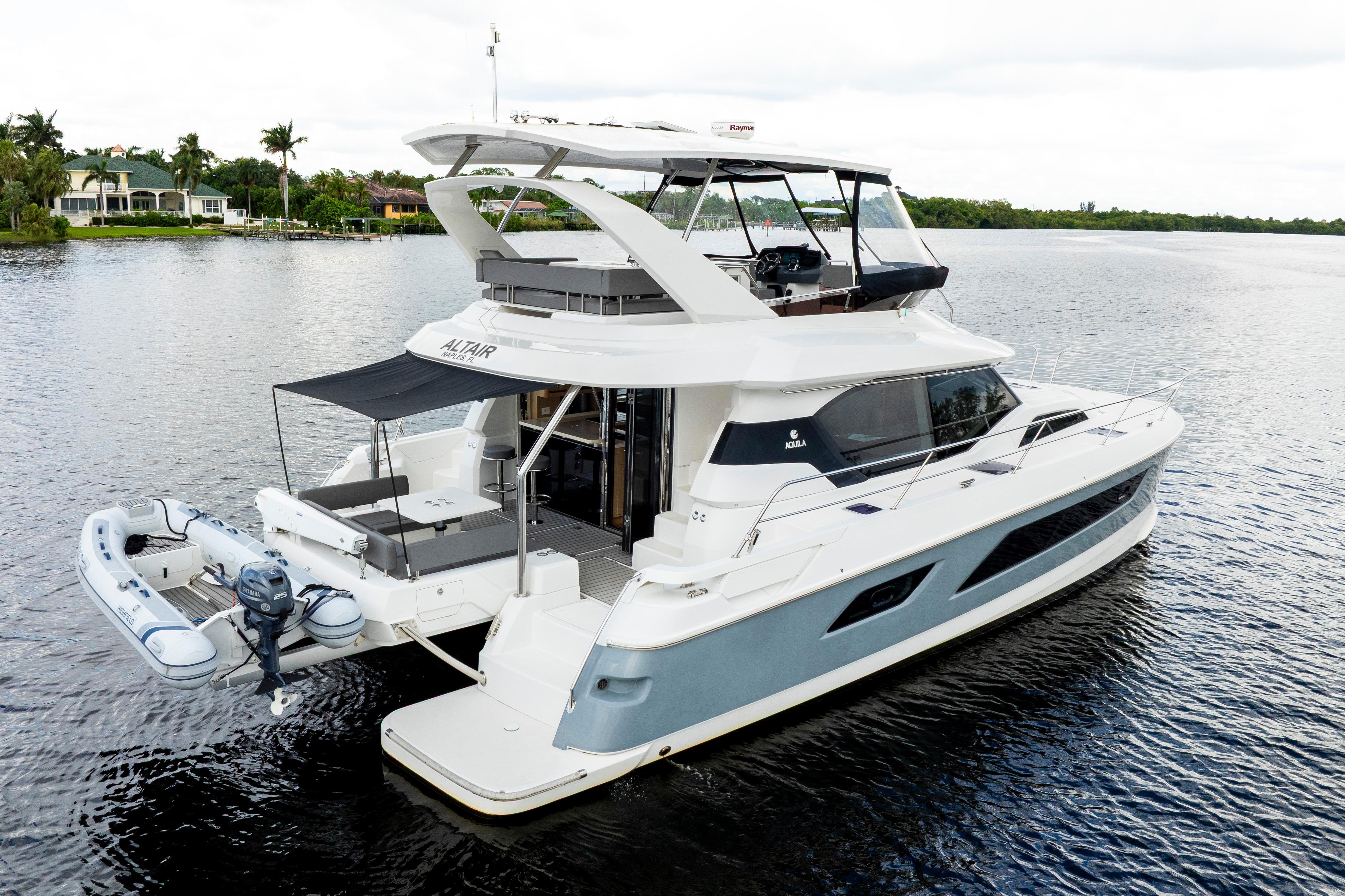 2019 Aquila 44 Yacht on calm water, featuring modern design and spacious deck.