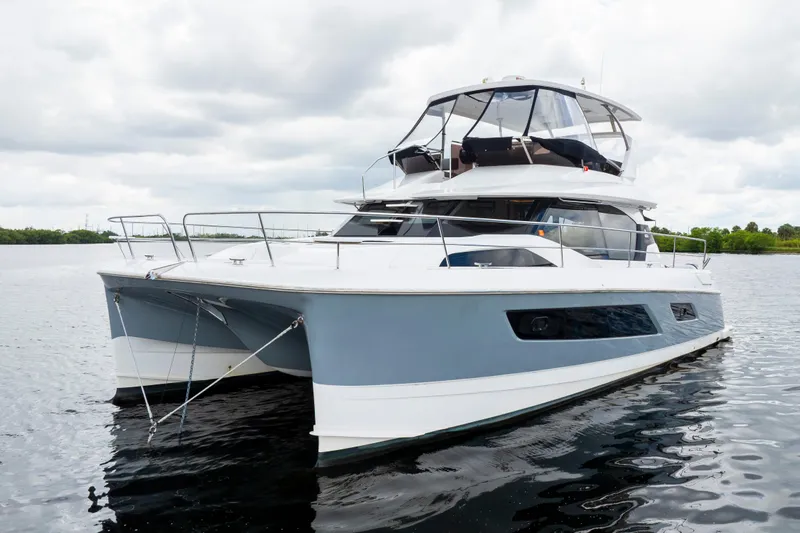 Altair Yacht Photos Pics 2019 Aquila 44 Yacht on calm water, showcasing sleek design and modern features.