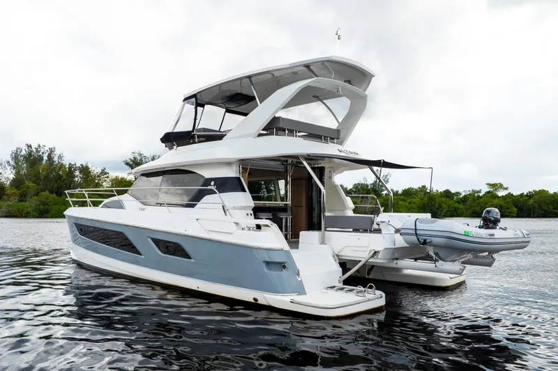 Altair Yacht Photos Pics 2019 Aquila 44 Yacht on calm water, featuring sleek design and modern amenities.