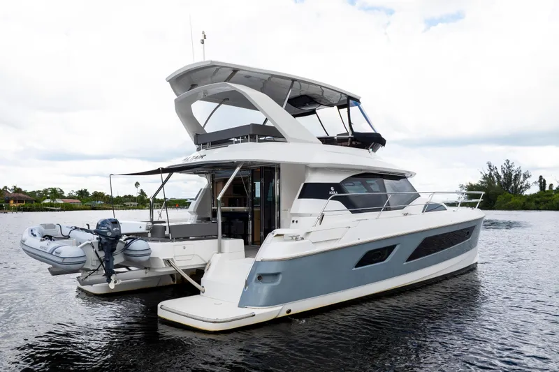 Altair Yacht Photos Pics 2019 Aquila 44 Yacht on calm water, showcasing sleek design and modern features.