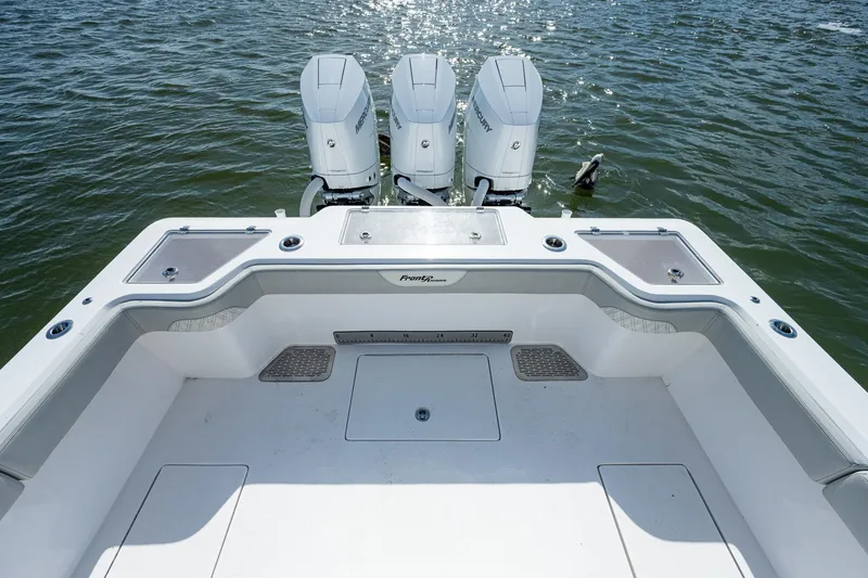 Yea Bey Yacht Photos Pics 2021 Front Runner 36 Center Console boat with triple outboard engines on water.