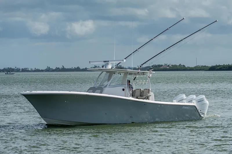 Yea Bey Yacht Photos Pics 2021 Front Runner 36 Center Console boat on calm waters with fishing rods.