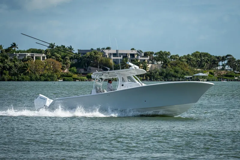 Yea Bey Yacht Photos Pics 2021 Front Runner 36 Center Console boat cruising on a lake.