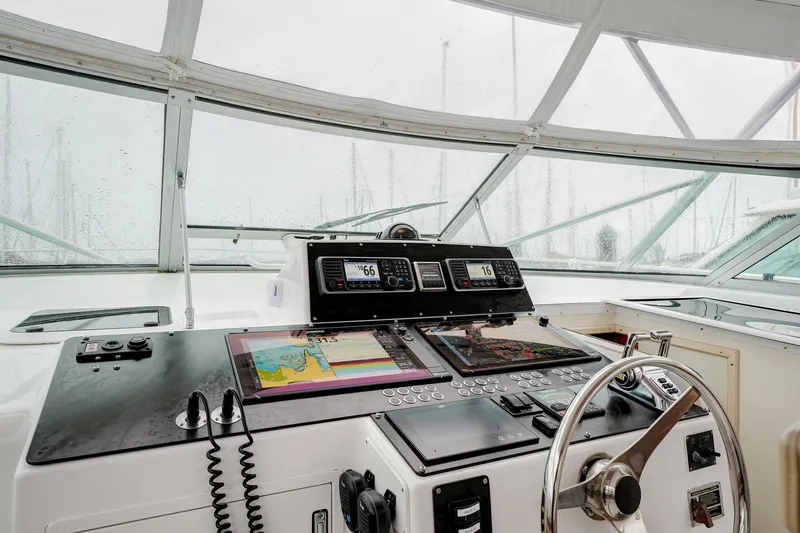 Archangel Yacht Photos Pics Cockpit of 1992 Viking 43 Open yacht with navigation equipment and steering wheel.