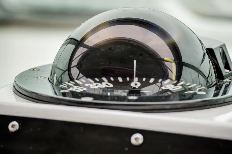 Archangel Yacht Photos Pics Close-up of a compass on a 1992 Viking 43 Open boat.
