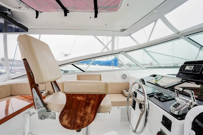 Archangel Yacht Photos Pics Interior of 1992 Viking 43 Open yacht with helm, seating, and navigation equipment.