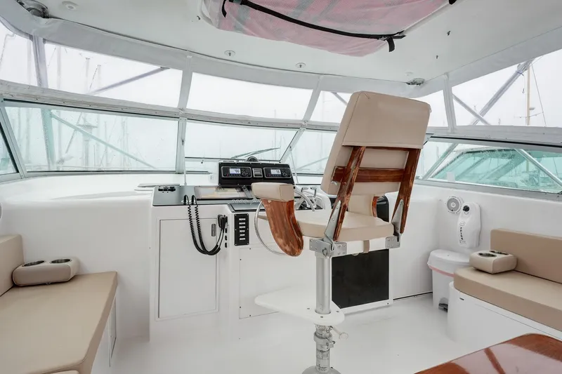 Archangel Yacht Photos Pics Interior of 1992 Viking 43 Open yacht with helm station and seating area.