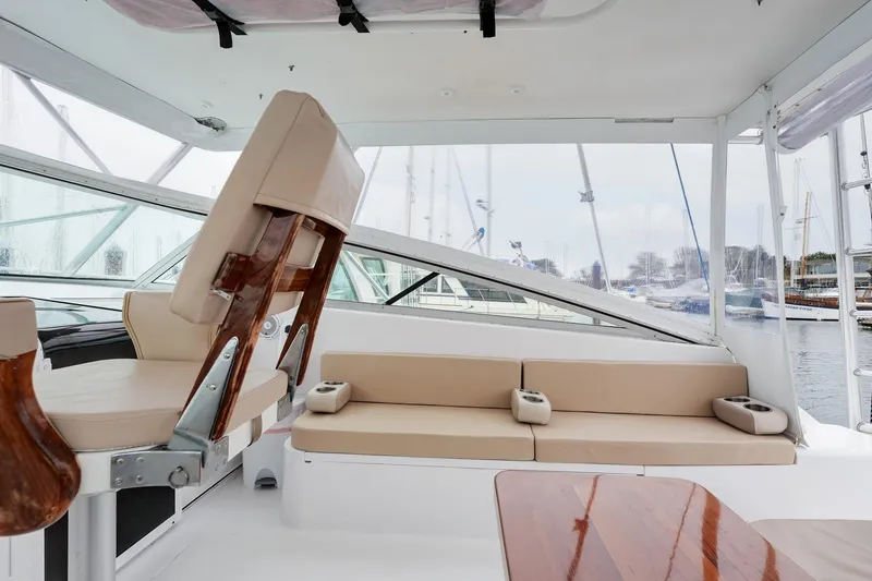 Archangel Yacht Photos Pics Interior of 1992 Viking 43 Open yacht with beige seating and wooden accents.