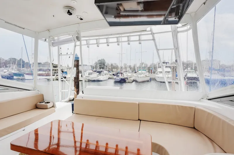 Archangel Yacht Photos Pics Interior view of 1992 Viking 43 Open yacht with marina backdrop.