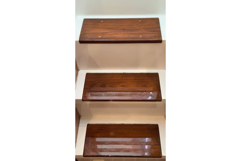 Archangel Yacht Photos Pics Polished wooden steps on a 1992 Viking 43 Open yacht interior.