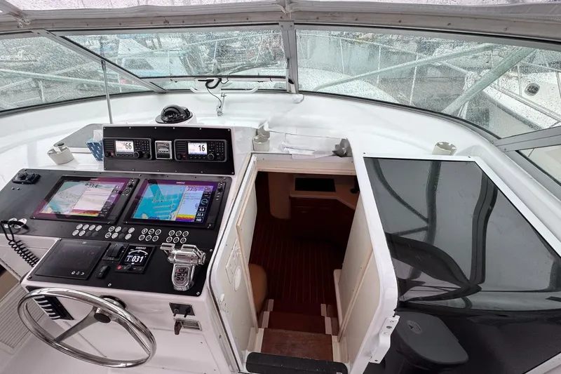 Archangel Yacht Photos Pics Cockpit of 1992 Viking 43 Open yacht with navigation equipment and steering wheel.