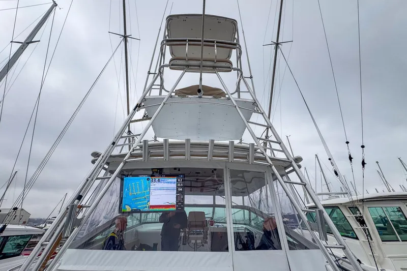 Archangel Yacht Photos Pics 1992 Viking 43 Open yacht with tower, docked under cloudy skies.