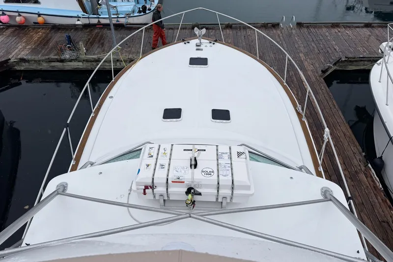 Archangel Yacht Photos Pics 1992 Viking 43 Open yacht docked at marina, view from bow.