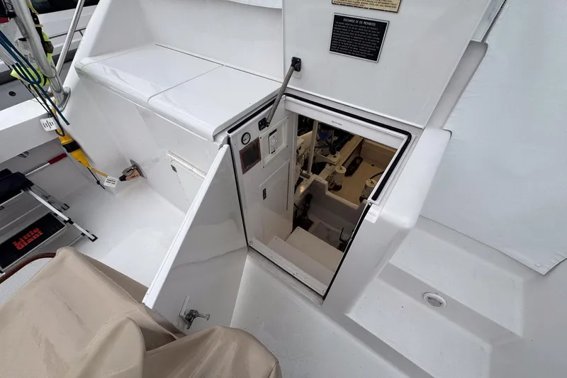 Archangel Yacht Photos Pics Engine room access on 1992 Viking 43 Open yacht, featuring white deck and equipment.